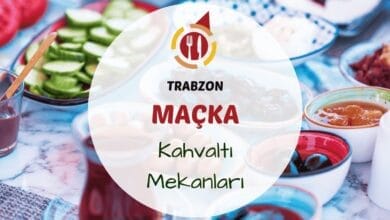Maçka'da yeşillikler içinde kurulan bir serpme kahvaltı sofrası görünümü